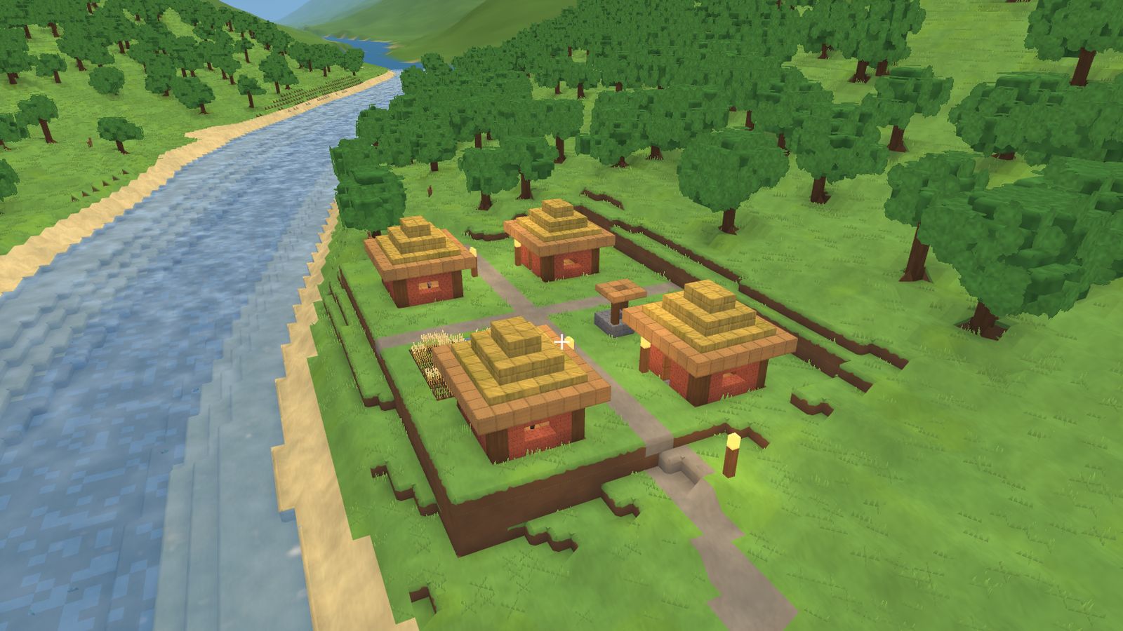 A river valley with a second village of brick cottages and a gravel road