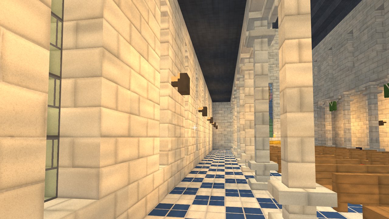 A side aisle of the cathedral with stone columns and a chequered floor
